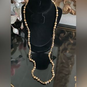 Vintage multifaceted gold tone necklace.